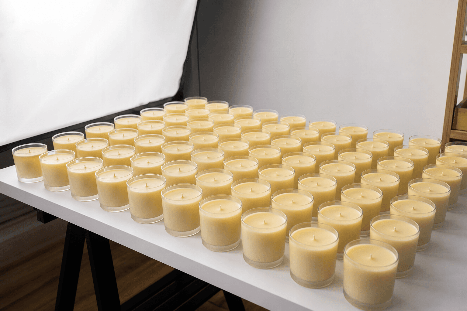 Rows of handmade candles prepared for batch marketplace product photography